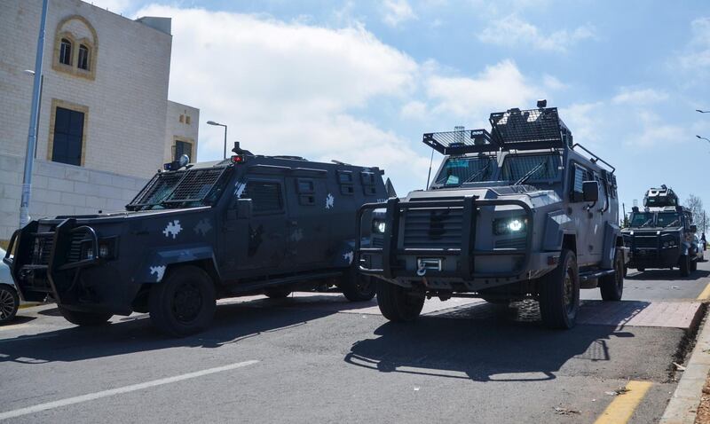 Gendarmerie vehicles deploy outside the new government hospital in the city of Al Salt, Jordan, after seven patients died there following a shortage of oxygen. Reuters