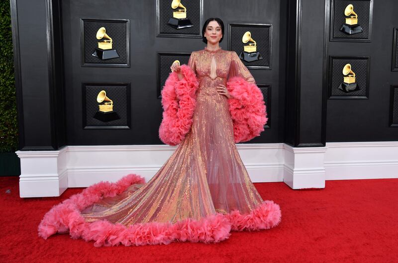 St Vincent wore a resplendent pink dress with ruffled sleeves. AFP