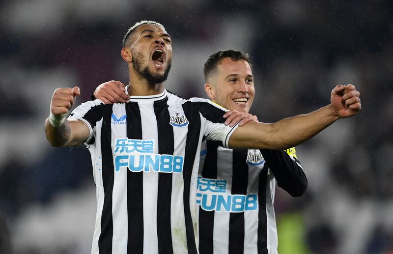 Joelinton celebrates with Javier Manquillo after scoring his second and Newcastle's fifth goal. Reuters