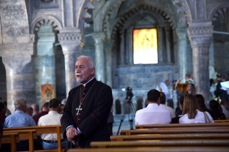 Iraqi Christians attend a mass at the historical church of Mar Toma, western Mosul in northern Iraq.  EPA