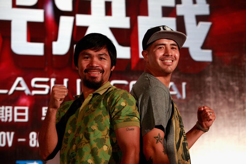 SHANGHAI, CHINA - JULY 31:  Manny Pacquiao (L) and Brandon Rios (R) pose for a picture during a press conference on July 31, 2013 in Shanghai, China.  (Photo by Kevin Lee/Getty Images) *** Local Caption ***  175071974.jpg