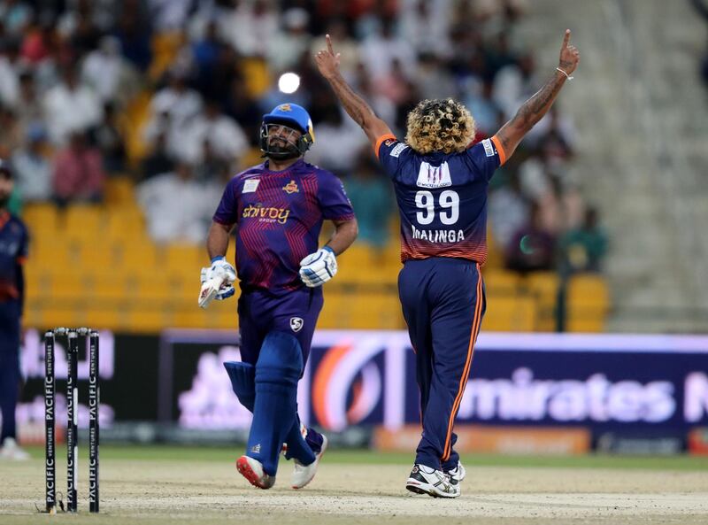 Abu Dhabi, United Arab Emirates - November 24, 2019: Arabians' Lasith Malinga takes the wicket of Gladiators' Mohammad Shahzad during the final between the Deccan Gladiators and the Maratha Arabians in the Abu Dhabi T10 league. Sunday, November 24th, 2017 at Zayed Cricket Stadium, Abu Dhabi. Chris Whiteoak / The National