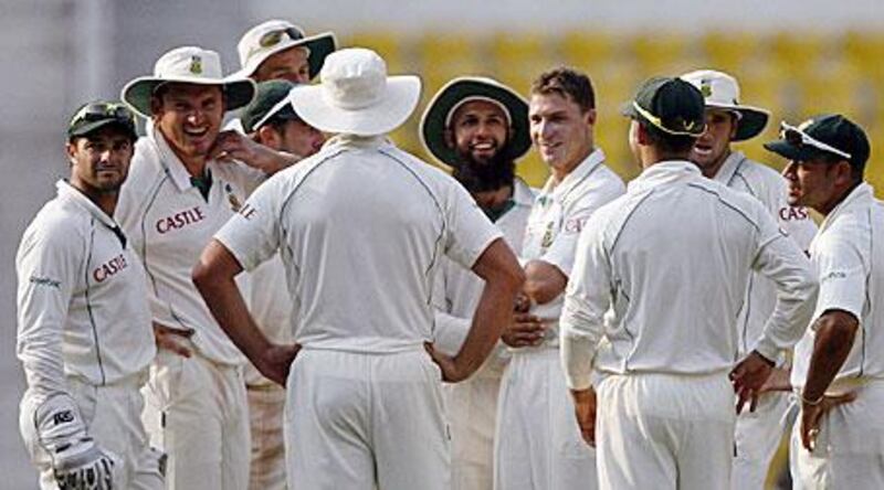 The South African players celebrate and enjoy the rewards of a job well done. Hashim Amla (bearded), centre, was named man of the match.