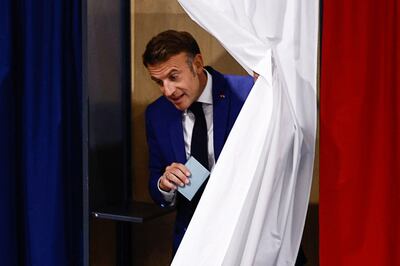 Emmanuel Macron leaves a voting booth, in Le Touquet-Paris-Plage, northern France, on June 30. EPA 