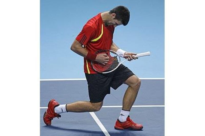 Novak Djokovic "performs" after taking a point against Rafael Nadal at the ATP World Tour Finals in London.