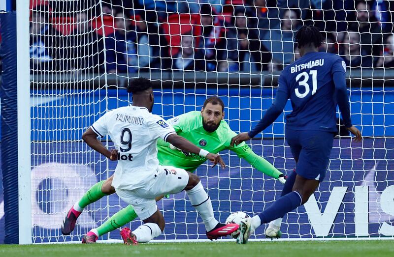 Rennes' Arnaud Kalimuendo scores their second goal past Gianluigi Donnarumma. Reuters