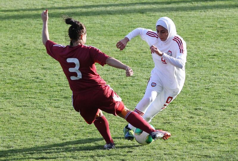 Shahad Budebs, right, is challenged by Latvia's Anna Proposina during their game at the 1st Aphrodite Cyprus Cup at Pegia Stadium in 2012. Sakis Savvides