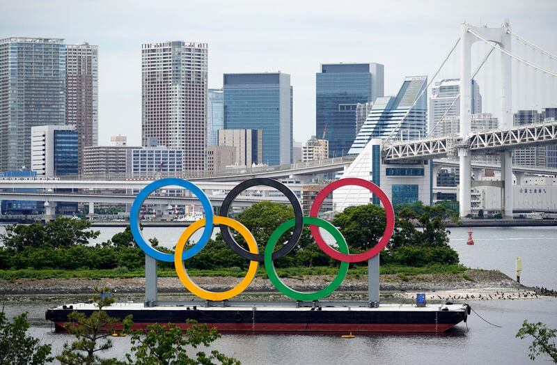 epa09242579 A giant Olympic rings monument is seen at Odaiba Marine Park in Tokyo, Japan, 12 May 2021 (issued 02 June 2021). On 02 June 2021, the Tokyo Organizing Committee for the Olympic Games announced that some 10,000 volunteers out of the approximately 80,000 have refused to be part of the Games.  EPA/FRANCK ROBICHON