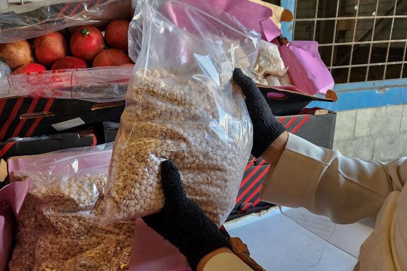 Bags of amphetamine tablets, which were hidden in boxes of pomegranates, seized in Jeddah, Saudi Arabia, earlier this year. AFP
