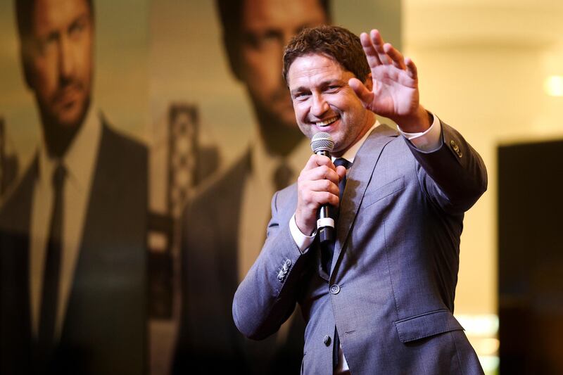 Dubai, UAE, March 20, 2015:

Gerard Butler greeted fans today at the Paris Gallery in Dubai Mall. The actor is a brand ambassador for Hugo Boss and as such does various promotional campaigns for the brand.

He is seen here waving to a fan who pulled out a Scottish flag, Mr. Butler is from Scotland. 
 
Lee Hoagland/The National  *** Local Caption ***  LH0320_GERARD_BUTLER_0001.JPG