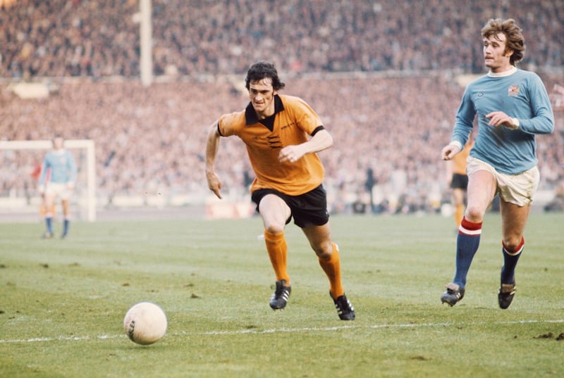 LONDON, UNITED KINGDOM - MARCH 02: Wolves player Kenny Hibbitt (l) and Rodney Marsh of Manchester City challenge for the ball during the 1974 League cup Final between Wolverhampton Wanderers and Manchester City at Wembley Stadium on March 2, 1974 in London, England. (Photo by Don Morley/Allsport/Getty Images)