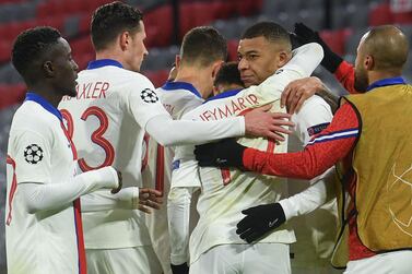 Paris Saint-Germain forward Kylian Mbappe (2nd R) celebrates scoring their third goal in the 3-2 win against Bayern Munich. AFP