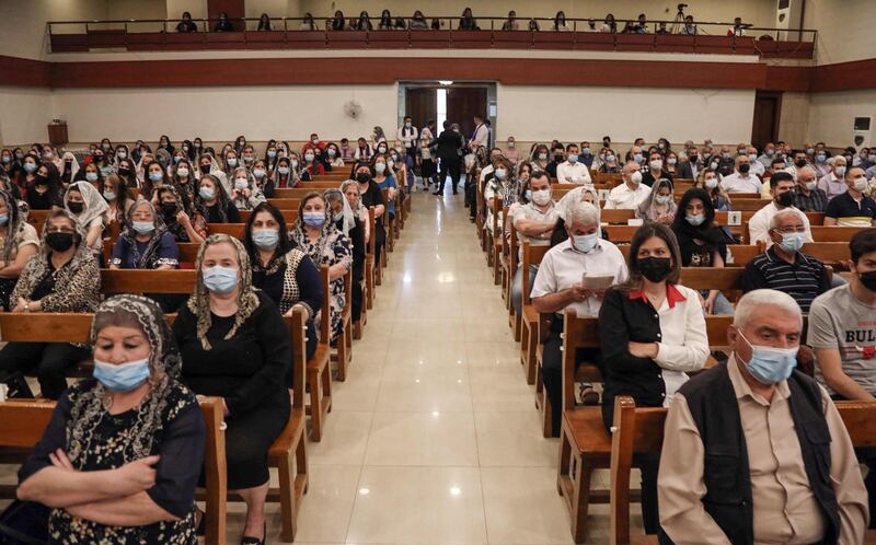 Worshippers attend a Palm Sunday service at the Syriac Orthodox Church of Umm Al Noor in Erbil in the Kurdish region in northern Iraq. AFP