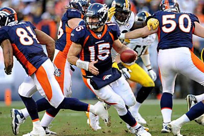 Denver Broncos quarterback Tim Tebow (15) runs against the Pittsburgh Steelers in the second quarter of an NFL wild card playoff football game, Sunday, Jan. 8, 2012, in Denver. (AP Photo/The Denver Post, Joe Amon)  MANDATORY CREDIT; MAGS OUT; TV OUT