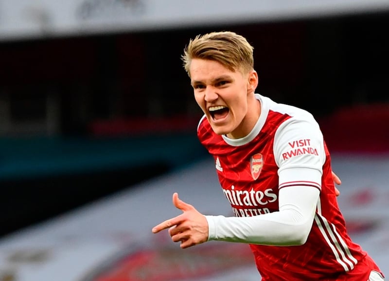 epa09074278 Arsenal's Martin Odegaard celebrates after scoring the 1-1 equalizer during the English Premier League soccer match between Arsenal FC and Tottenham Hotspur in London, Britain, 14 March 2021.  EPA/Dan Mullan / POOL EDITORIAL USE ONLY. No use with unauthorized audio, video, data, fixture lists, club/league logos or 'live' services. Online in-match use limited to 120 images, no video emulation. No use in betting, games or single club/league/player publications.