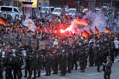 Right wing demonstrators light flares on August 27, 2018 in Chemnitz, eastern Germany, following the death of a 35-year-old German national who died in hospital after a "dispute between several people of different nationalities", according to the police.
The far-right street movement PEGIDA called for a second day of protests in Chemnitz in ex-communist eastern Germany after the alleged fatal stabbing of a German man by a foreigner. / AFP PHOTO / Odd ANDERSEN