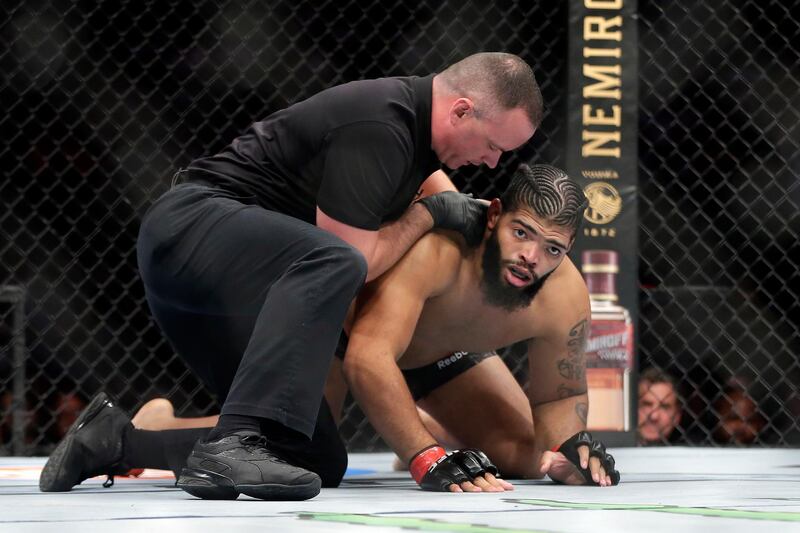 Juan Adams reacts as the referee stops the fight in the first round against Justin Tafa at UFC 247. AP