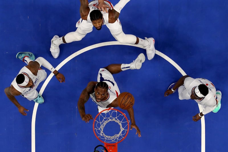 DALLAS, TEXAS - JUNE 04: Kawhi Leonard #2 of the LA Clippers rebounds the ball against the Dallas Mavericks during Game Six of the Western Conference first round series at American Airlines Center on June 04, 2021 in Dallas, Texas. NOTE TO USER: User expressly acknowledges and agrees that, by downloading and or using this photograph, User is consenting to the terms and conditions of the Getty Images License Agreement.   Tom Pennington/Getty Images/AFP
== FOR NEWSPAPERS, INTERNET, TELCOS & TELEVISION USE ONLY ==
