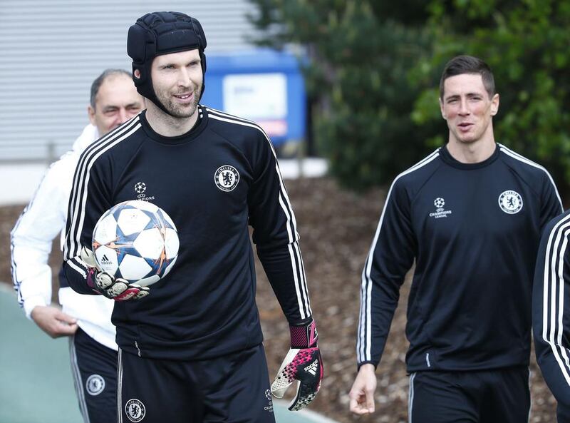 Chelsea goalkeeper Petr Cech, left, and Fernando Torres arrive for a soccer training session at Cobham in Surrey in south England April 29, 2014. Chelsea will play Atletico Madrid in their Uefa Champion's League semi-final second leg match on Wednesday.   REUTERS/Eddie Keogh