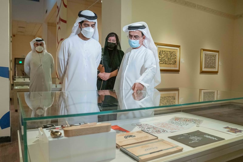 Sheikh Salem bin Abdul Rahman Al Qasimi, chairman of the Sharjah Ruler's Office, with artist Mohammed Mandi and Manal Ataya, director general of Sharjah Museums Authority, at the opening of Luminous Letters. Photo: Sharjah Museums Authority