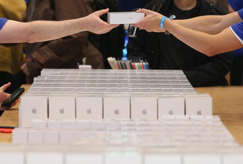 Sales assistants prepare new Apple iPhone 6 phones and other Apple products at the Apple Store in Berlin, Germany. Sean Gallup / Getty Images 