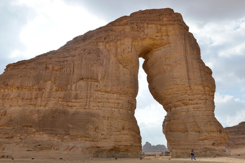 A tourist looks at Elephant Rock in the Ula desert near the twon of al-Ula, Saudi Arabia. AFP