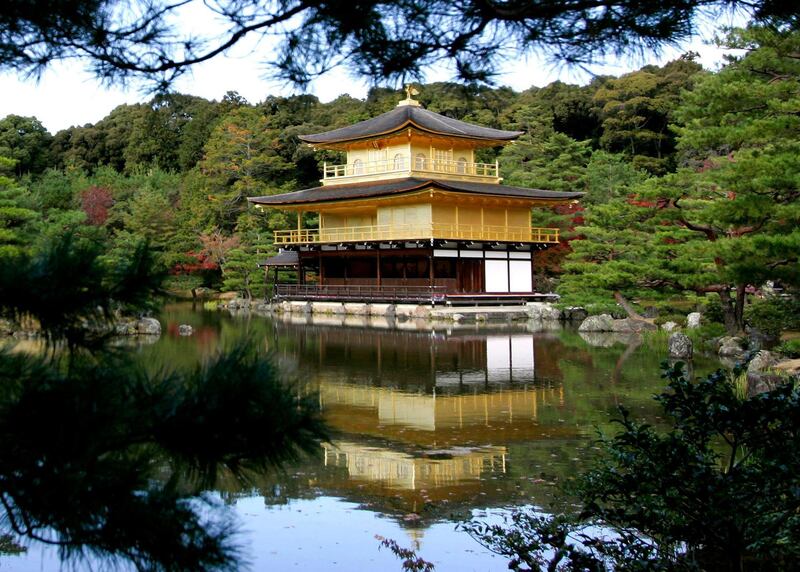 A view of the Golden Pavilion Kinkakuji Temple as it is reflected in water in Kyoto, Japan November 15, 2005. U.S. President George W. Bush and first lady Laura Bush will visit the temple on the first full day of their eight-day trip to Asia on Tuesday. REUTERS/Jason Reed
