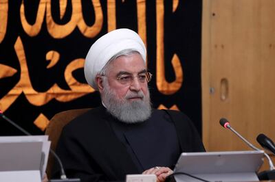 In this photo released by the official website of the office of the Iranian Presidency, President Hassan Rouhani heads a cabinet meeting in Tehran, Iran, Wednesday, Sept. 11, 2019. Rouhani urged the U.S. on Wednesday to "put warmongers aside" as tensions roil the Persian Gulf amid an escalating crisis between Washington and Tehran in the wake of the collapsing nuclear deal with world powers. (Iranian Presidency Office via AP)