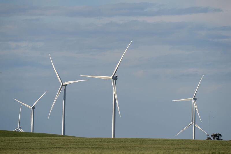 Wind turbines stand at the Hornsdale wind farm, operated by Neoen SAS, near Jamestown, South Australia, on Friday, Sept. 29, 2017. About half the capacity of the world’s largest lithium-ion battery project is installed at Hornsdale wind farm in South Australia, Tesla chief executive officer Elon Musk said at an event on Sept. 29. When this is done in just a few months, it will be the largest battery installation by a factor of three in the world, Musk said. Photographer: Carla Gottgens/Bloomberg