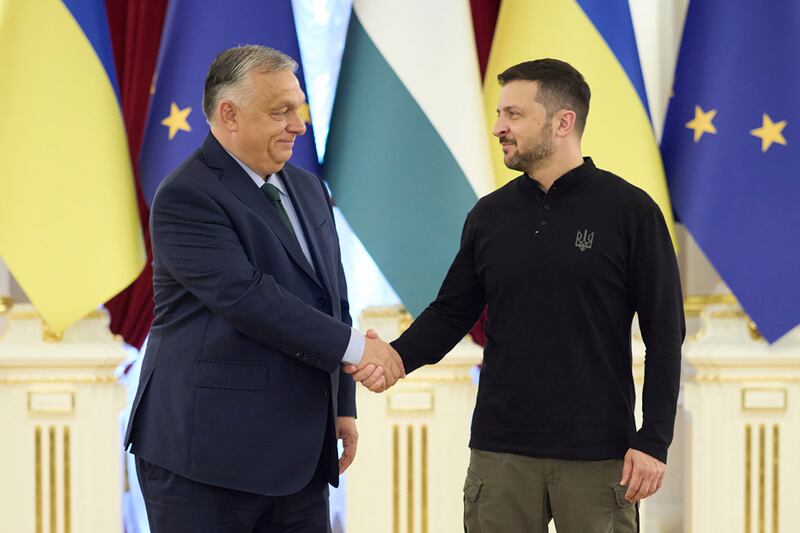 Ukrainian President Volodymyr Zelenskyy, right, welcomes Hungarian Prime Minister Viktor Orban to Kyiv on Tuesday. AP