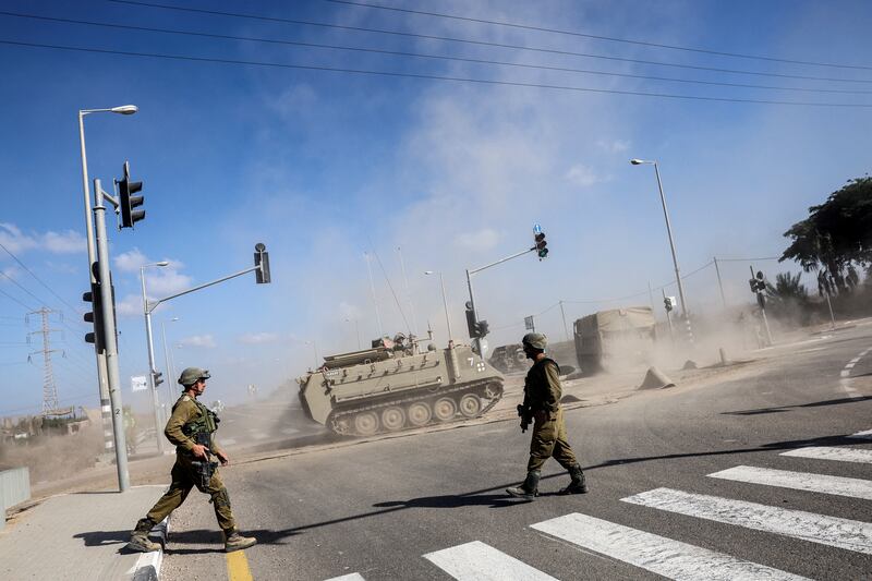 An Armoured Personnel Carrier drives near Israel's border with the Gaza Strip. Reuters