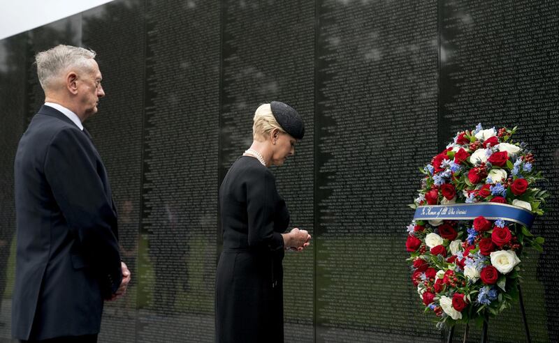 Cindy McCain, wife of John McCain, accompanied by defence secretary Jim Mattis lays a wreath at the Vietnam Veterans Memorial in Washington. AP