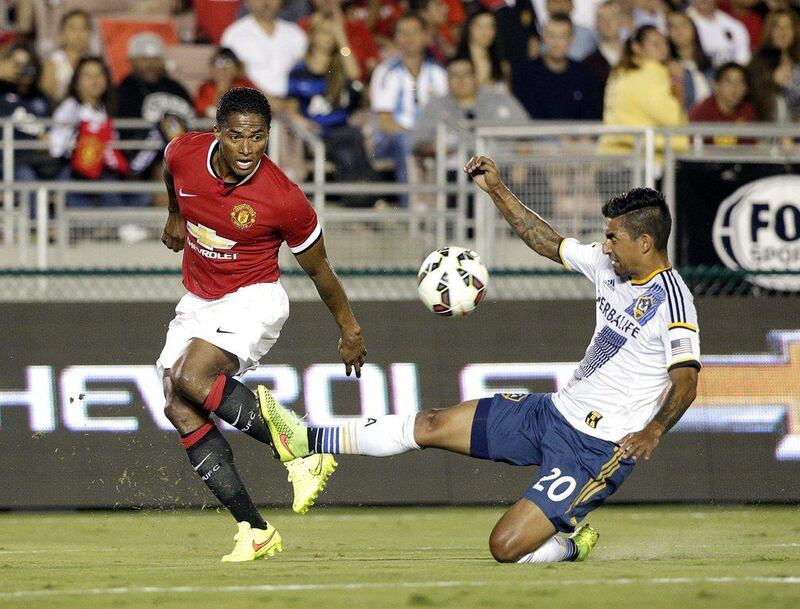 Manchester United's Antonio Valencia, left, is fouled by LA Galaxy's AJ De La Garza, right, during their international friendly on Wednesday. AP Photo