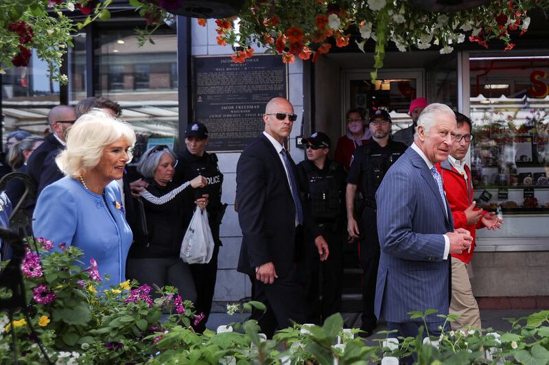 Britain's Prince Charles and Camilla, Duchess of Cornwall walk along a street, on the second day of the Canadian 2022 Royal Tour, in Ottawa. Reuters