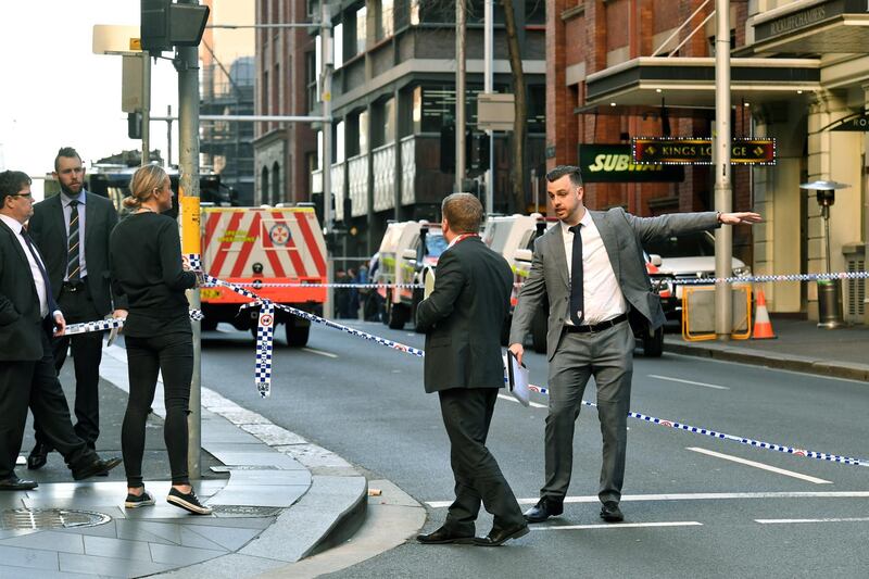 Authorities work near a crime scene after a knife attack in Sydney, Australia.  EPA