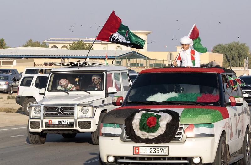 Hundreds of residents took the the streets of Umm al Quwain yesterday to participate in the National Day car parade.  Jeffrey E Biteng / The National 