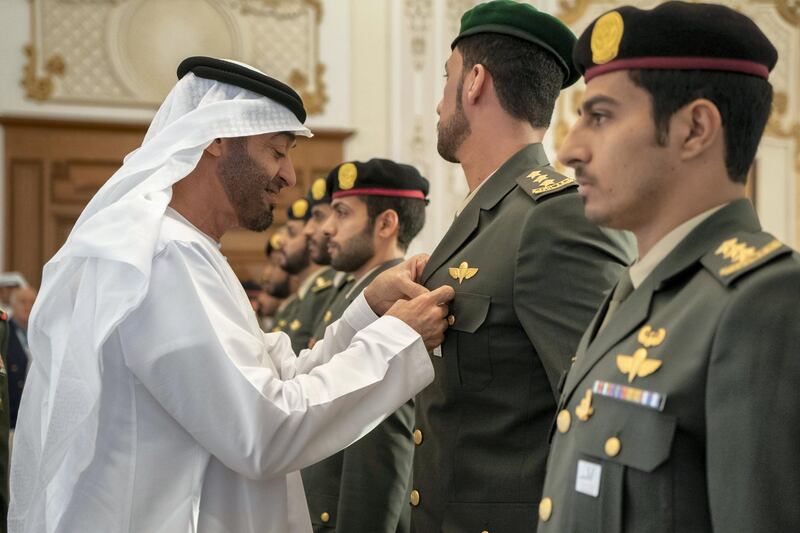 ABU DHABI, UNITED ARAB EMIRATES - October 14, 2019: HH Sheikh Mohamed bin Zayed Al Nahyan, Crown Prince of Abu Dhabi and Deputy Supreme Commander of the UAE Armed Forces (L) awards a member of the UAE Armed Forces with a Medal, during a Sea Palace barza.

( Rashed Al Mansoori / Ministry of Presidential Affairs )
---