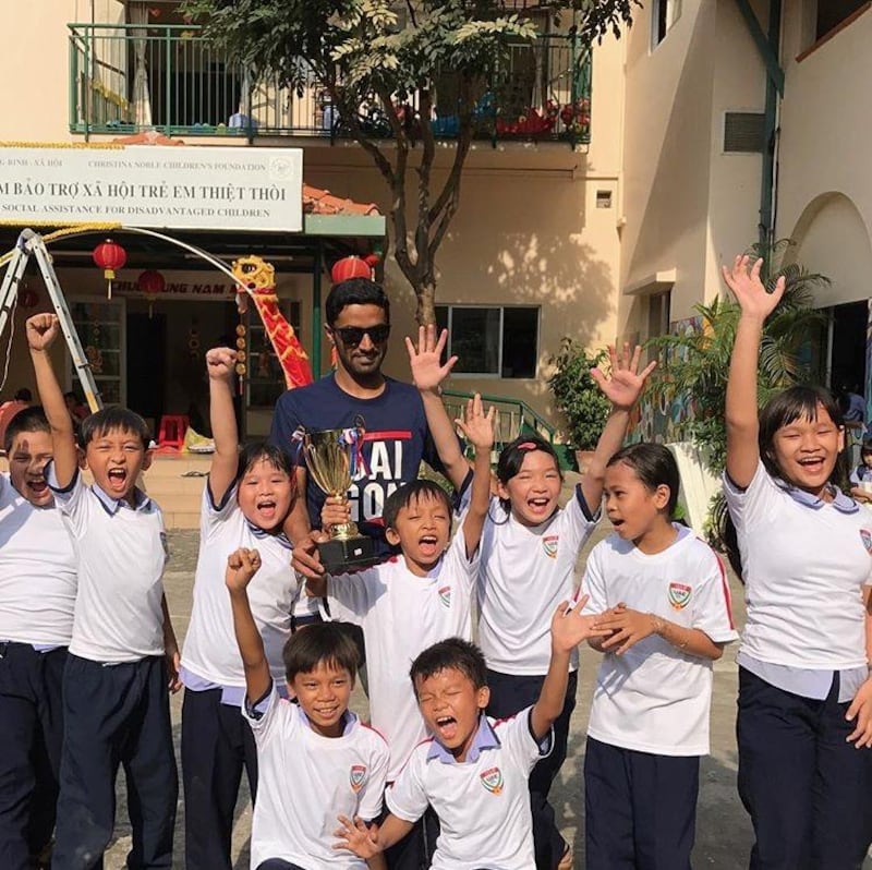 Salem Alkarbi hosts events for disadvantaged children worldwide through his football charity "Beyond the Boundaries of Football". Here he is in Vietnam. Courtesy Salem Alkarbi