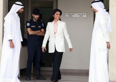 Former Kuwaiti MP Alia Al Khaled leaves after registering her candidacy for the parliamentary elections, in Kuwait City. AFP