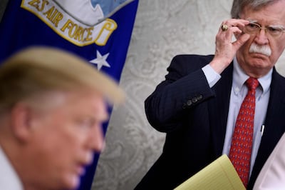 (FILES) In this file photo taken on May 13, 2019, National Security Advisor John Bolton listens while US President Donald Trump speaks to the press before a meeting with Hungary's Prime Minister Viktor Orban in the Oval Office of the White House in Washington, DC. US President Donald Trump on September 10, 2019, announced he has fired his hawkish national security advisor John Bolton, saying he disagreed "strongly" with his positions. "I asked John for his resignation, which was given to me this morning," Trump announced on Twitter. "I informed John Bolton last night that his services are no longer needed at the White House." Trump said he would name a replacement next week. / AFP / Brendan Smialowski
