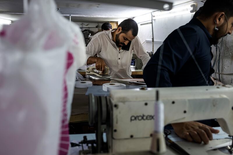 As the end of Ramadan approaches, tailors in Dubai's bustling Satwa neighbourhood are working overtime to prepare. All photos: Antonie Robertson / The National
