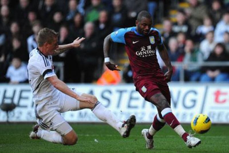 Aston Villa's Darren Bent, right, could find no way past the Swansea defence.