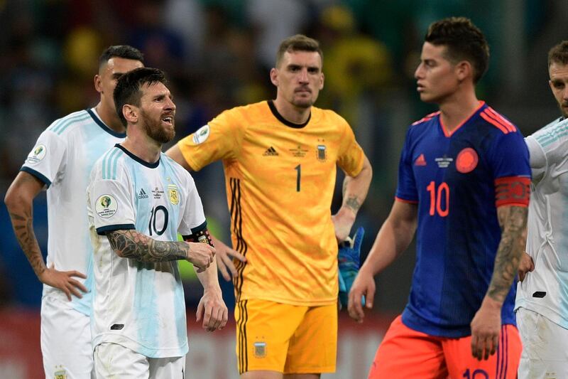 Argentina's Lionel Messi, left, looks dejected at the end of the match. AFP