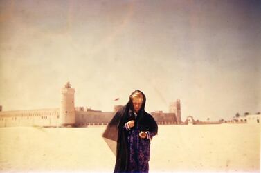Deborah outside Qasr Al Hosn in the 1950s. The building had just undergone a massive expansion whereby a new fort encircled the old. Courtesy Susan Hillyard