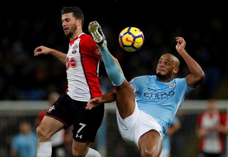 Soccer Football - Premier League - Manchester City vs Southampton - Etihad Stadium, Manchester, Britain - November 29, 2017   Manchester City's Vincent Kompany in action with Southampton's Shane Long    Action Images via Reuters/Lee Smith    EDITORIAL USE ONLY. No use with unauthorized audio, video, data, fixture lists, club/league logos or "live" services. Online in-match use limited to 75 images, no video emulation. No use in betting, games or single club/league/player publications. Please contact your account representative for further details.     TPX IMAGES OF THE DAY