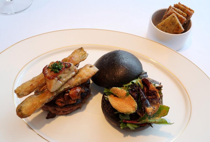 DUBAI, UNITED ARAB EMIRATES , Feb 20  – 2020 :- Gourmet Duck Burger at the Queen’s Grill restaurant on the QE 2 in Dubai. (Pawan  Singh / The National) For Lifestyle. Story by Janice Rodrigues