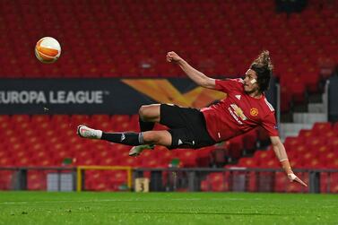 TOPSHOT - Manchester United's Uruguayan striker Edinson Cavani hits an unsuccessful shot during the UEFA Europa League semi-final, first leg football match between Manchester United and Roma at Old Trafford stadium in Manchester, north west England, on April 29, 2021. / AFP / Paul ELLIS