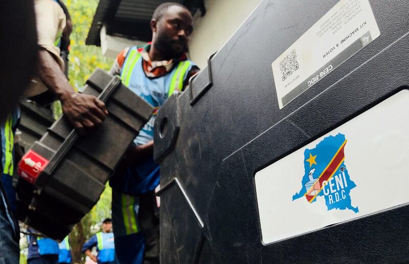 Employees of Congo's Independent National Electoral Commission (CENI) deliver voting machines and materials to a polling station in Kinshasa, Democratic Republic of Congo, December 28, 2018. REUTERS/Jackson Njehia