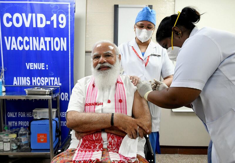 NEW DELHI, INDIA - MARCH 01: (----EDITORIAL USE ONLY  MANDATORY CREDIT - "INDIAN PRIME MINISTRY / HANDOUT" - NO MARKETING NO ADVERTISING CAMPAIGNS - DISTRIBUTED AS A SERVICE TO CLIENTS----) Indian Prime Minister Narendra Modi receives his first dose of a COVID-19 vaccine as the country kicked off the second phase of a vaccination drive, at AIIMS, in New Delhi, India on March 01, 2021. (Photo by Indian Prime Ministry/Handout/Anadolu Agency via Getty Images)