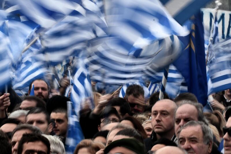 People holding flags of Greece take part in a demonstration to protest against the use of the name Macedonia following the developments on the issue with the neighbour country, in Thessaloniki on January 21, 2018.
Thousands of people are expected to take to the streets of northern Greece's biggest city Thessaloniki on January 21, 2018 as hardliners seek to block any deal in the long-running name dispute between Athens and Skopje that contains the term Macedonia. Athens argues that the name Macedonia suggests that Skopje has territorial claims to the northern Greek region of the same name, of which Thessaloniki is the capital.

 / AFP PHOTO / SAKIS MITROLIDIS